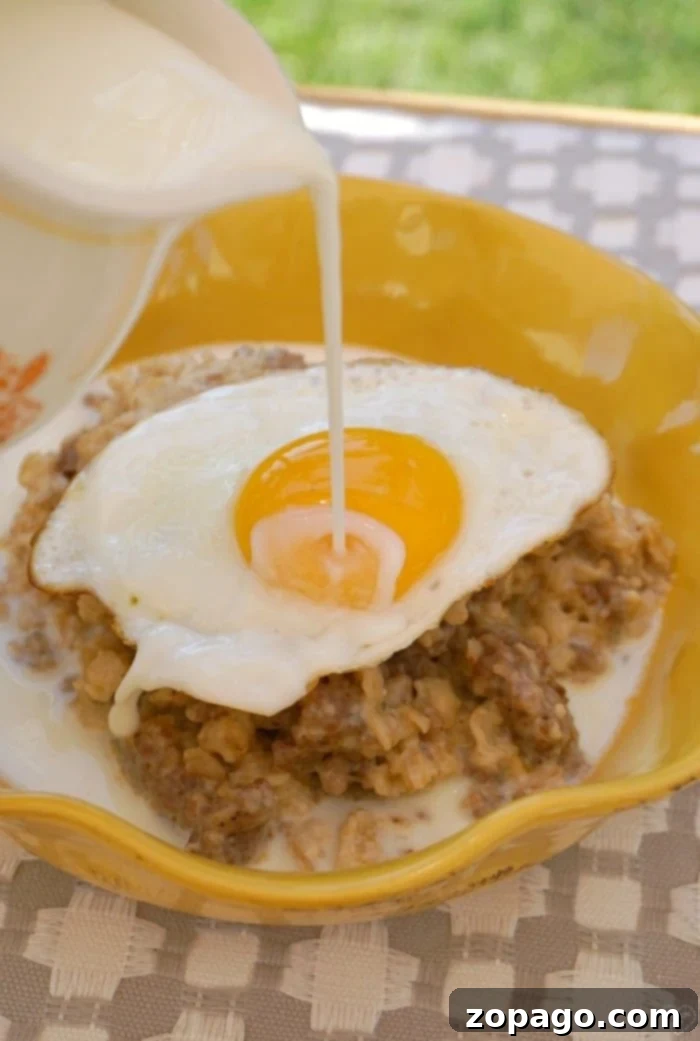 A beautifully presented bowl of savory oatmeal with various toppings.