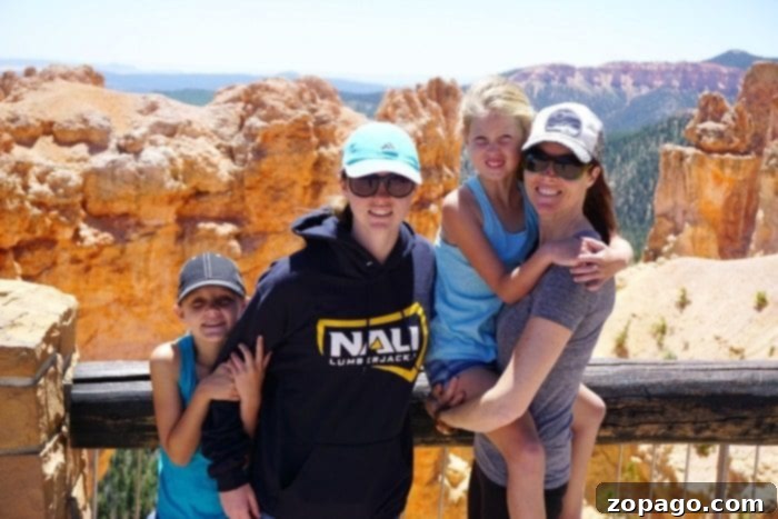 The Typical Mom blogger family enjoying Bryce Canyon Utah, a perfect destination for family travel. Mother and daughter enjoying the majestic views of Bryce Canyon