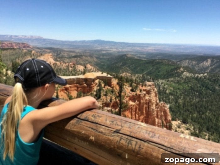 Memorable family moments captured amidst the grandeur of Bryce Canyon Utah. Family posing in front of Bryce Canyon's stunning landscape