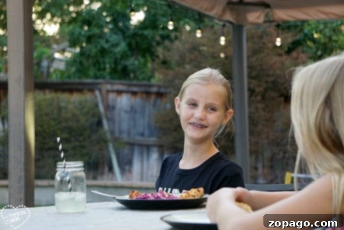 Unlock Your Kids' World 5 An outdoor patio illuminated by Enbrighten Cafe Lights, perfect for family dinners.
