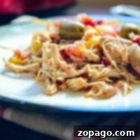 Slow cooker shredded chicken with herbs, a close-up shot