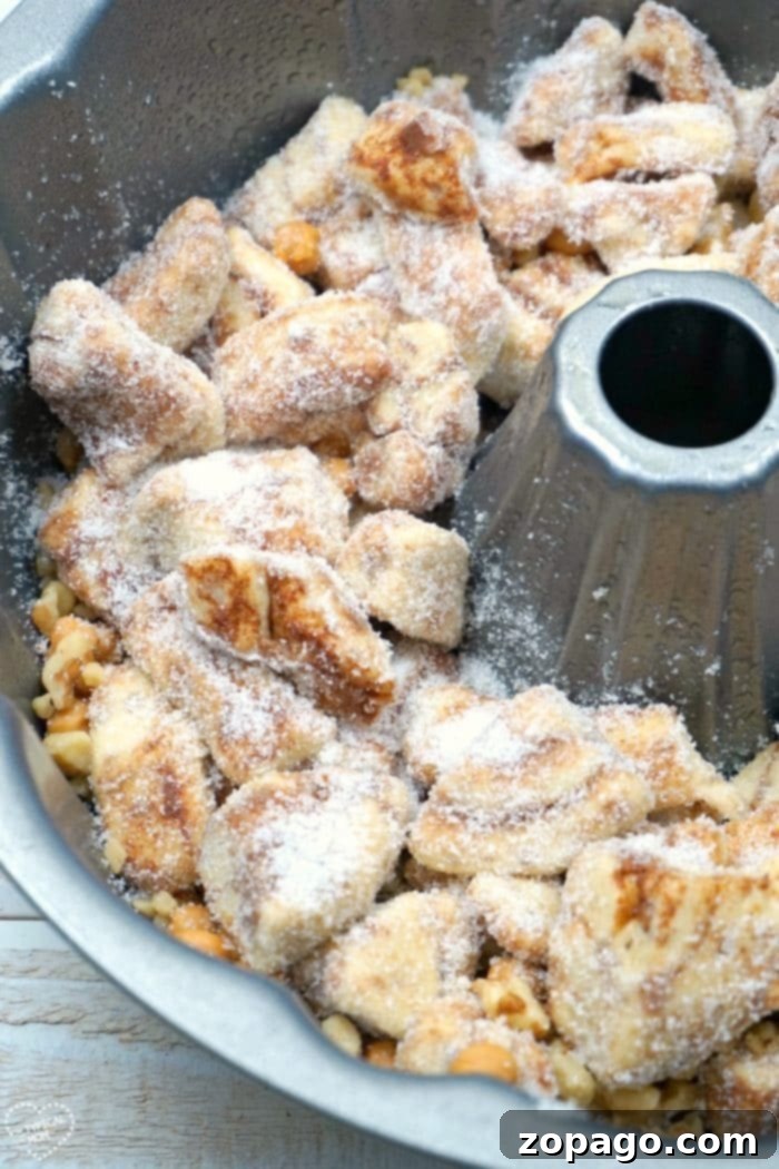 This is the most amazing caramel pumpkin monkey bread you will ever make and it is really easy too!! The best Fall breakfast or dessert I've ever made! #pumpkin #monkeybread #dessert #breakfast #bread #caramel caramel pumpkin monkey bread