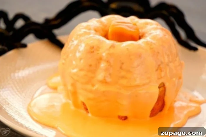 Easy Pumpkin Bundtlets 5 A batch of pumpkin-shaped mini bundt cakes ready for frosting.