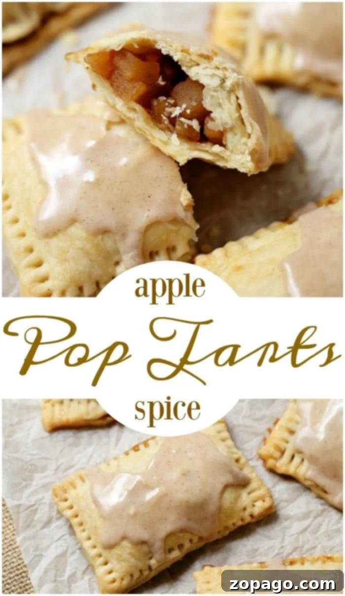 Close-up of three golden-brown homemade pop tarts with a glossy white glaze and apple filling visible, resting on parchment paper.