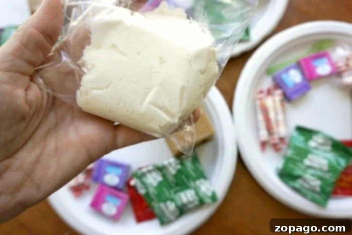 Close-up of candies and frosting for gingerbread house decorations.