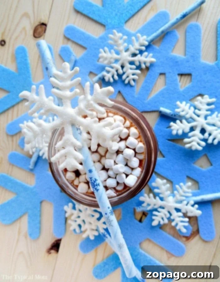 Elevate Your Hot Chocolate with DIY Snowflake Stirrers 2 Homemade chocolate snowflake stirrers, perfect for hot cocoa at Christmas or as a treat for a Frozen themed birthday party. Easy and fun DIY project.