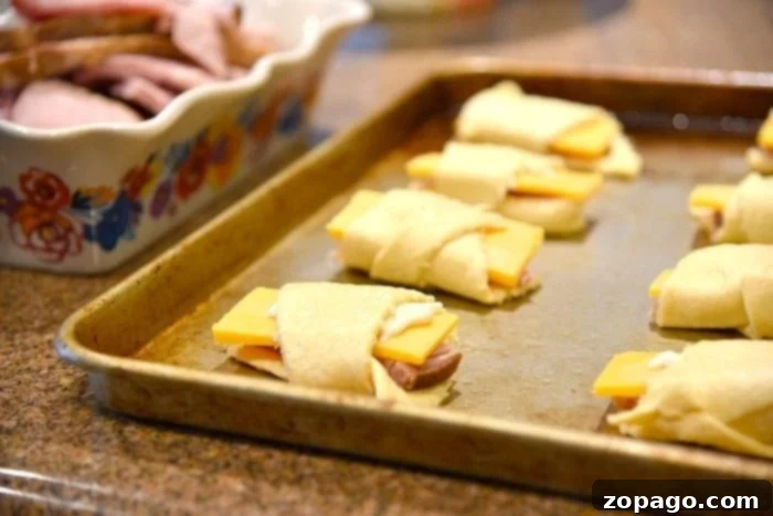 Baked Ham and Cheese Crescent Roll Ups 3 Close-up of baked ham and cheese roll ups on a plate