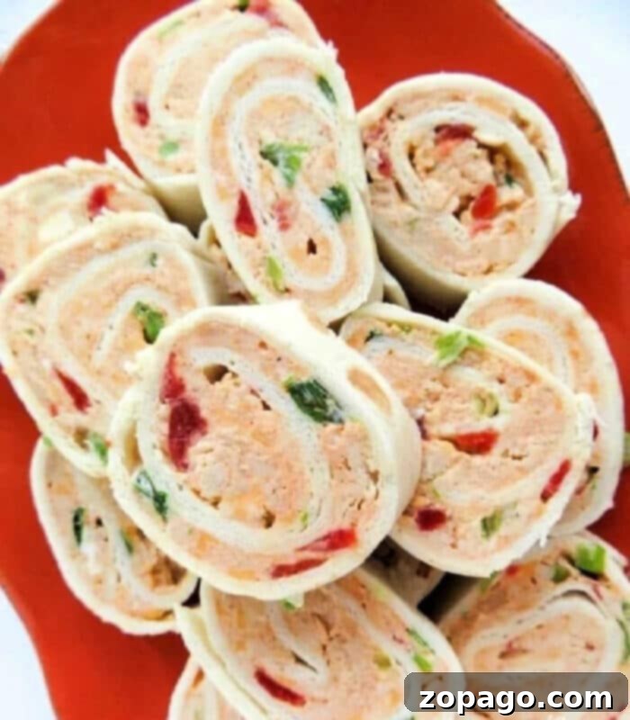 Creamy Tortilla Pinwheel Bites 2 Delicious Philadelphia Cream Cheese Pinwheels on a platter, ready to serve, showcasing their vibrant filling.