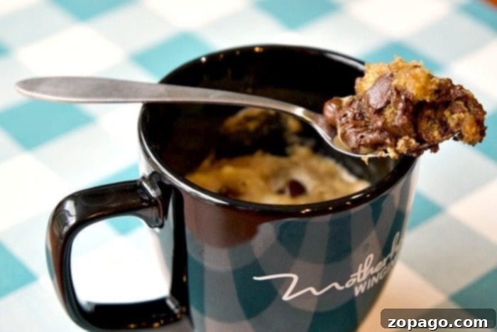 Chocolate chip cookie in a mug: The ultimate 1-minute microwave dessert for one. No sharing required for this easy, best-ever sweet treat! ;) #chocolatechip #chocolate #cookie #mug #dessert #microwave #one #minute #easy #best A delectable chocolate chip cookie in a mug, cooked to perfection and ready for a single serving.