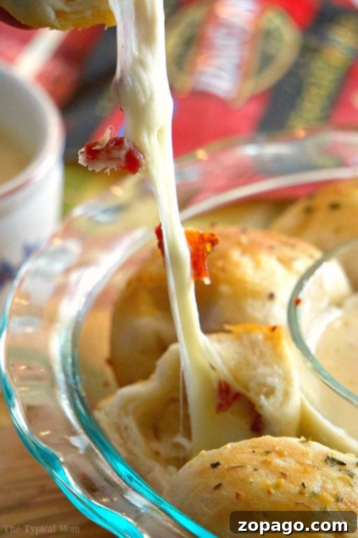 Gooey Cheesy Bacon Pull-Aparts 6 Bacon bombs or small bundles of bacon and cheese ready for baking.