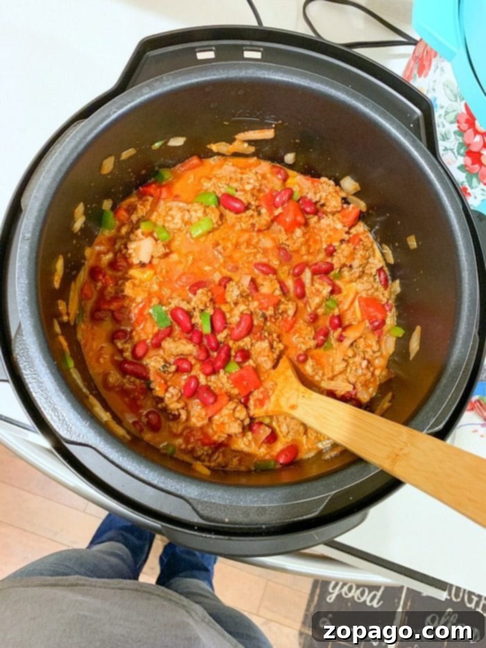 Speedy Instant Pot Chili 5 A rich and hearty Instant Pot chili served in a rustic bowl, ready to be enjoyed.