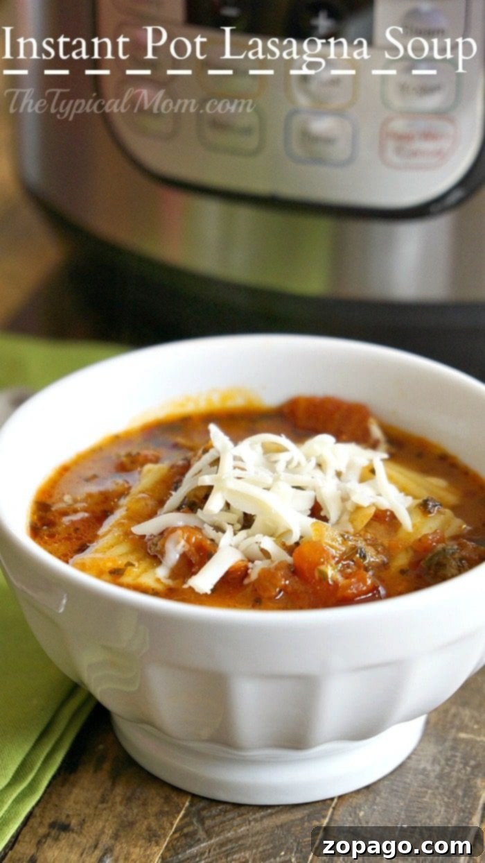 Instant Pot lasagna soup is amazing and healthy!! You can make it in the slow cooker too but in your pressure cooker it's done in just 8 minutes! #lasagnasoup #lasagna #soup #instantpot #pressurecooker #instantpotrecipes #thetypicalmom A large bowl of Instant Pot lasagna soup, garnished with fresh herbs and a spoon, ready for a delicious meal.