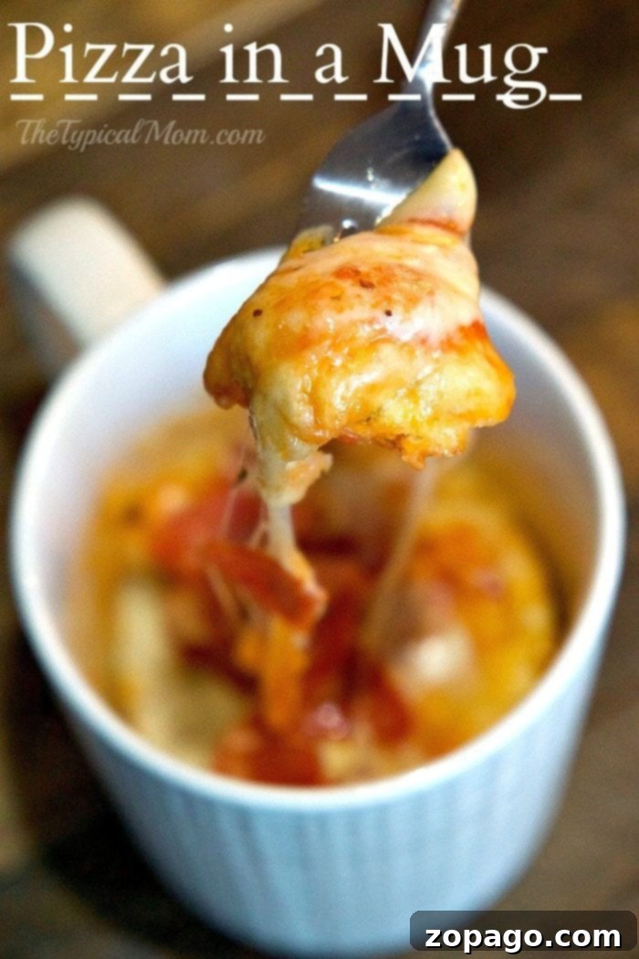Quick and easy microwave pizza in a mug with cheesy toppings, ideal for a personal, fast meal. A top-down view of a microwave pizza in a mug, highlighting the perfectly melted cheese and generous toppings, ready for a quick snack.