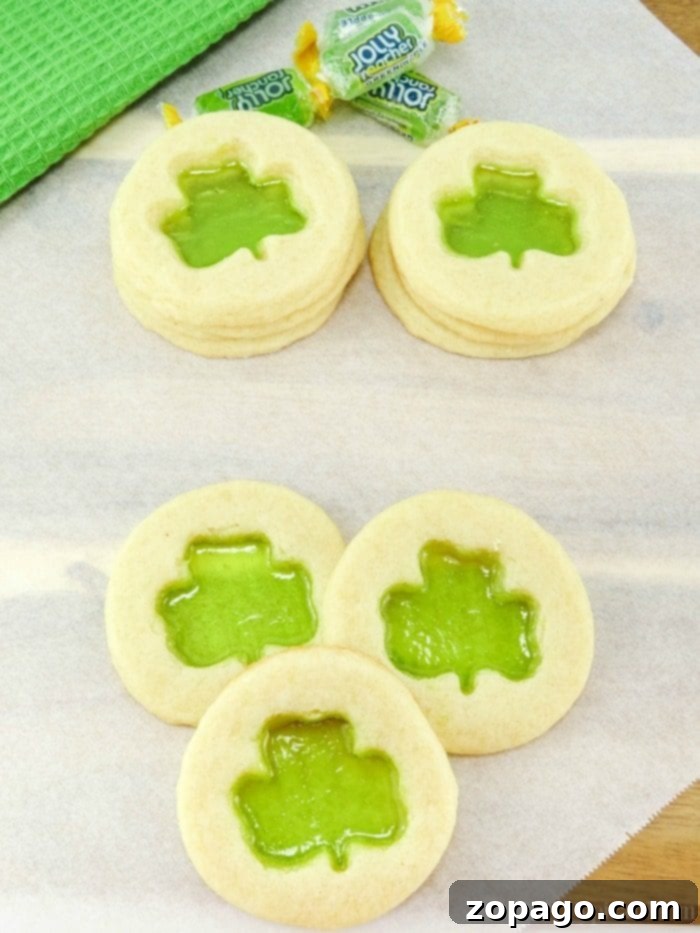 The cutest Shamrock cookies that are easy to make. Great St.Patrick's Day dessert to make with your kids that taste great and look really cute. shamrock cookies