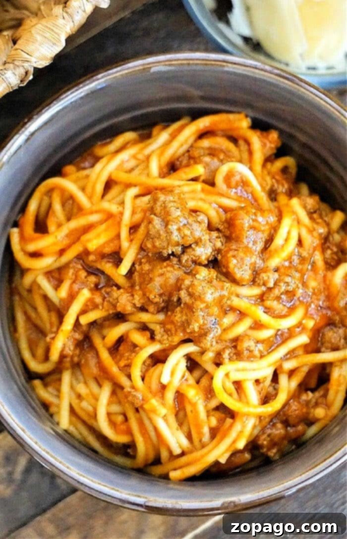 Easy Instant Pot Spaghetti 2 Instant Pot spaghetti with jar sauce and ground beef, ready to be cooked.