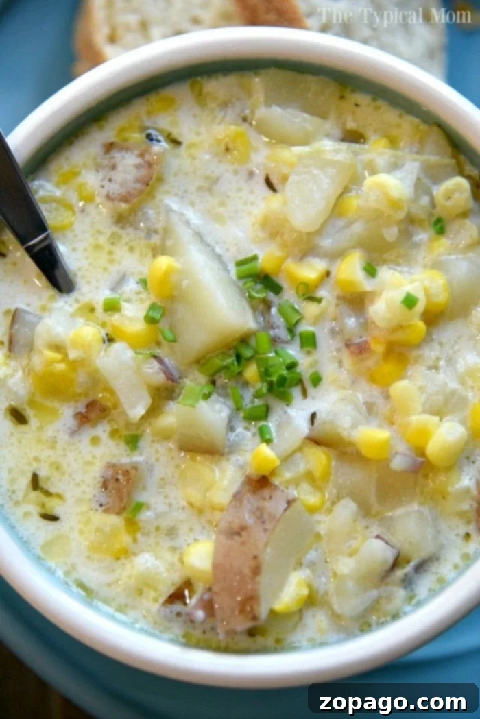 This easy Instant Pot potato corn chowder recipe is amazing and quick. An appetizing serving of Instant Pot potato corn chowder in a white bowl, ready for a delicious meal.