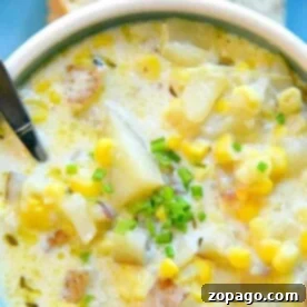 A bowl of creamy instant pot potato corn chowder with a spoon.
