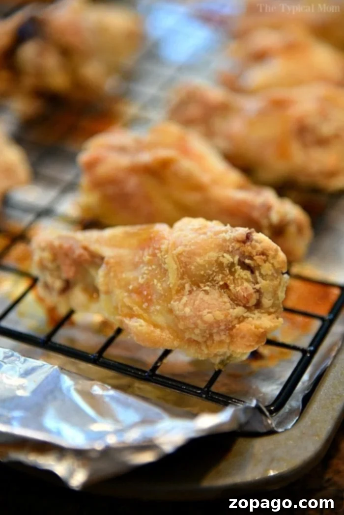 Ultimate Crispy Chicken Wings: Baking Perfection at 425 2 Close-up of golden-brown, crispy oven-baked chicken wings seasoned with baking powder, showcasing their irresistible texture.