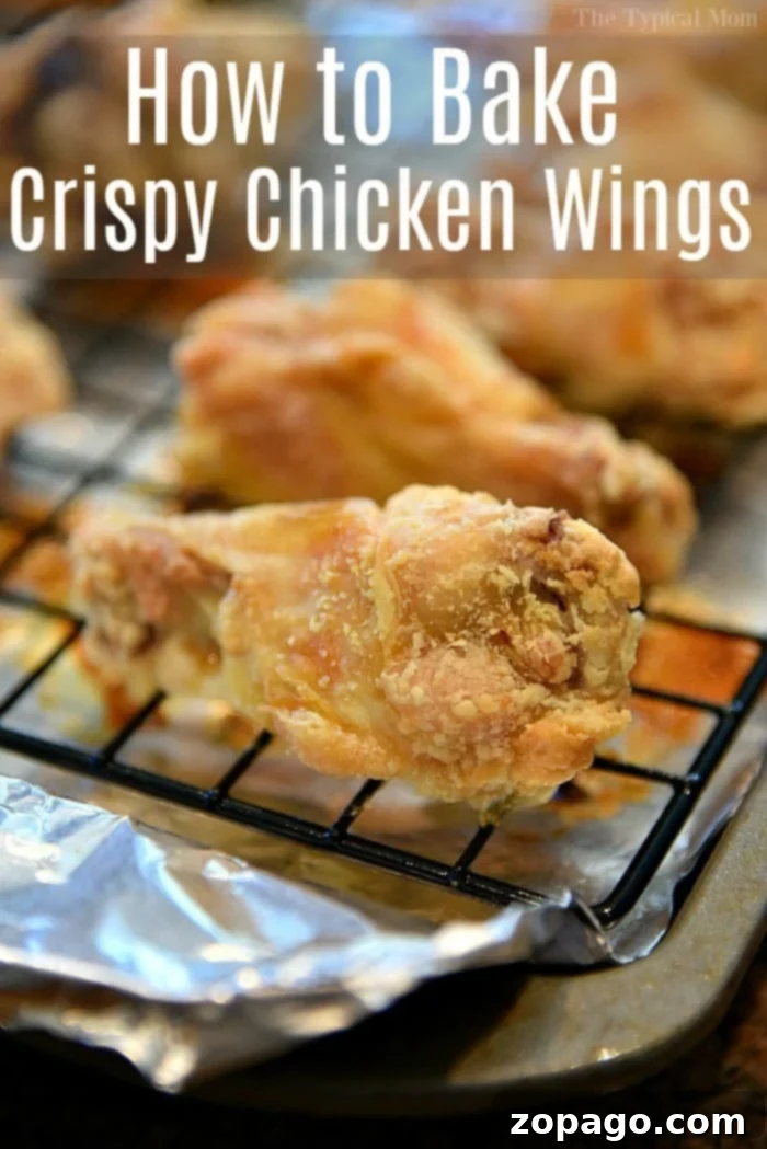 Your guide to the crispiest baked chicken wings without frying. Sauced crispy chicken wings, ready to be served, emphasizing the delicious outcome of baking powder wings.