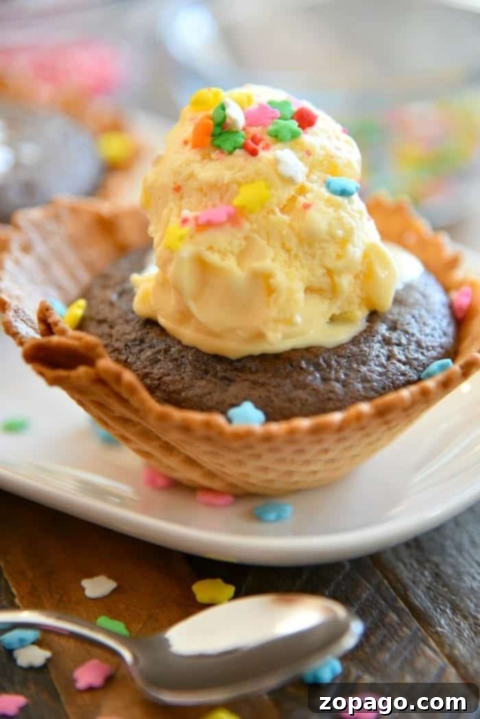 These cupcake sundae bowls are the perfect birthday party dessert. Make a sundae bar with these edible cupcake bowls filled with cake and ice cream! Delightful cupcake sundaes in waffle bowls, perfect for a birthday party dessert bar