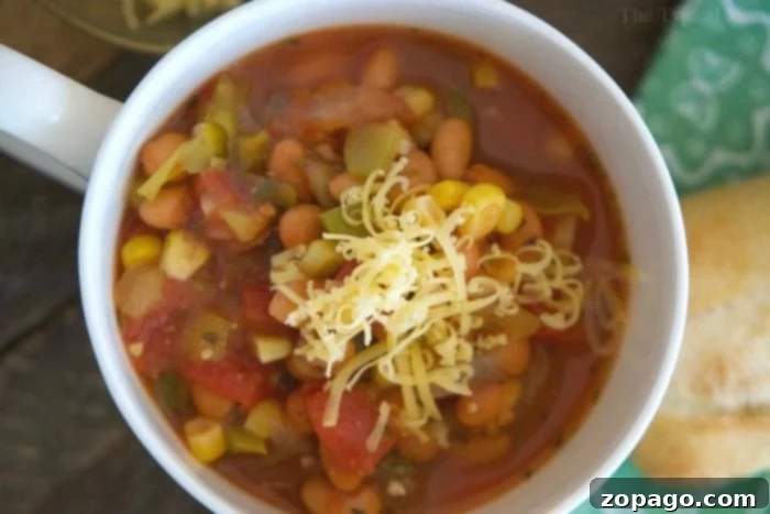 This easy chili bean recipe is a quick and hearty dinner with just enough spice for everyone! Three bean vegetarian chili we love in just 20 minutes flat. easy chili bean recipe in a pot