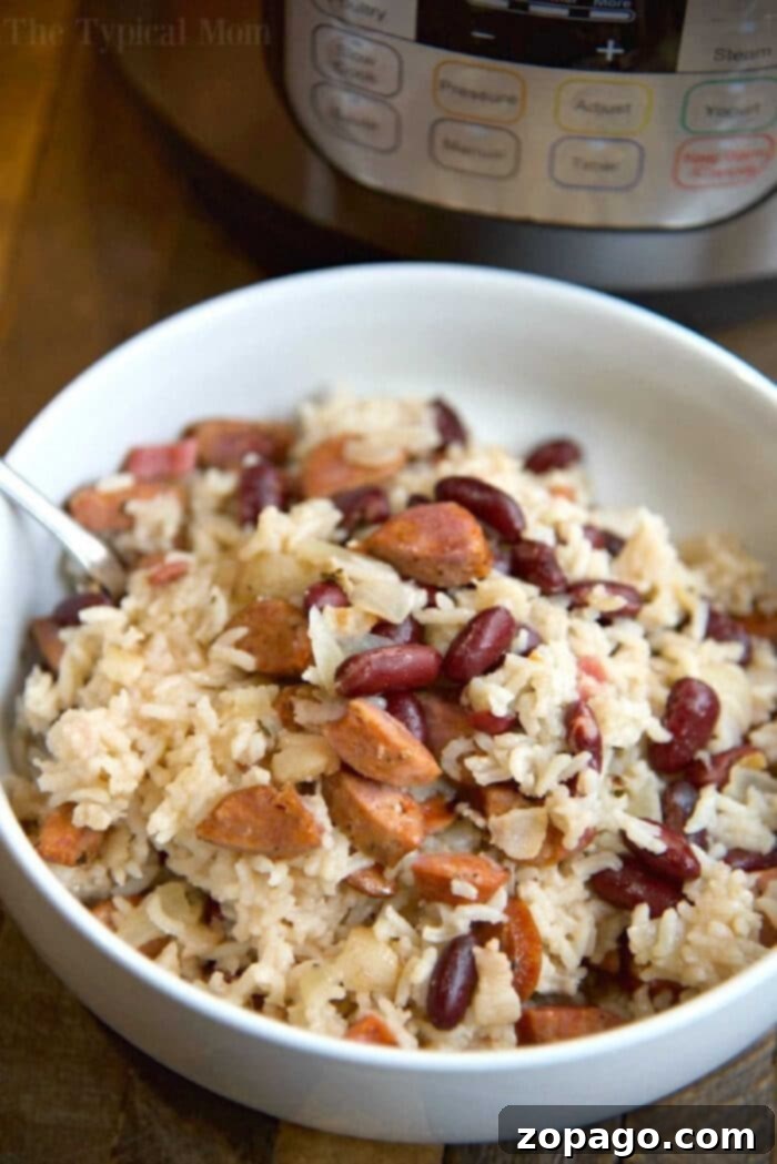 Best Instant Pot Red Beans and Rice Recipe with Canned Beans. Easy, cheap, and hearty pressure cooker dinner with uncooked rice, kidney beans, and optional kielbasa sausage. A family favorite one-pot meal. Flavorful Instant Pot Red Beans and Rice with Canned Beans and Sausage, served in a bowl.