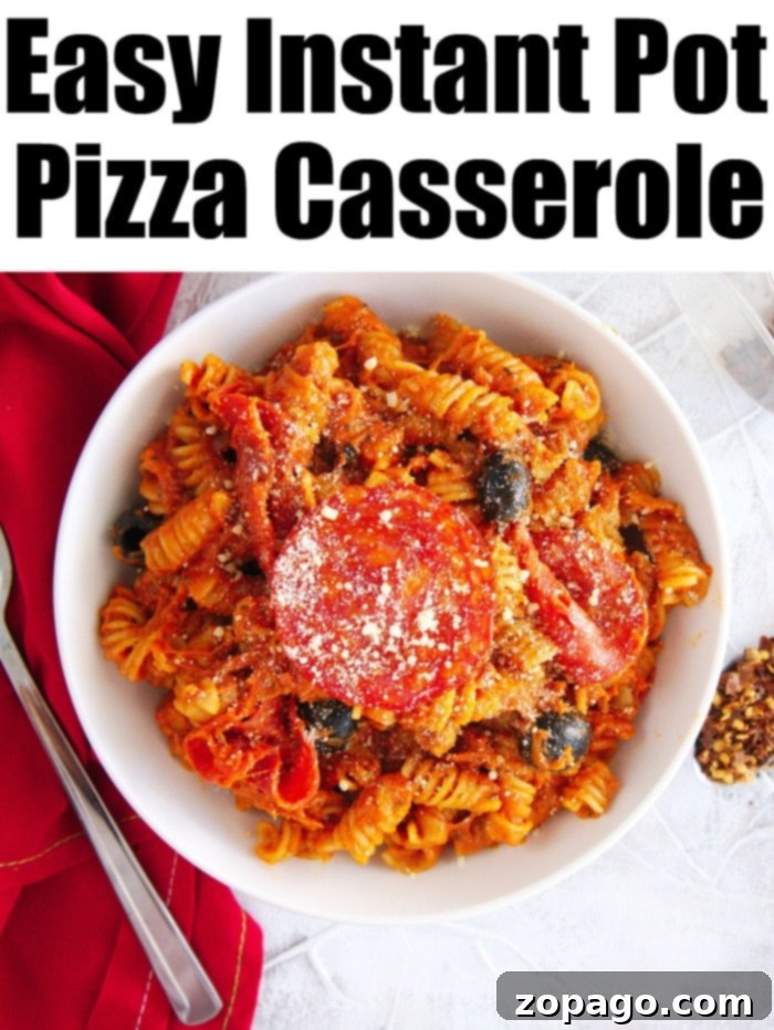 Instant Pot pizza casserole is incredibly easy and delicious. Simply combine all your ingredients in the pressure cooker with your favorite pizza toppings for a quick family dinner. #InstantPotCasserole #PizzaNight #OnePotMeal Instant Pot pizza casserole with melted cheese and fresh basil garnish.
