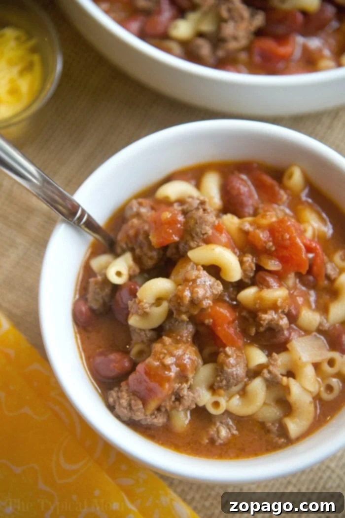Instant Pot chili mac recipe that takes 5 minutes to cook and you and your kids will love! A classic old fashioned goulash dinner packed with flavor. #instantpot #chilimac #chili #macaroni #goulash #pressurecooker #groundbeef #instantpotrecipes #thetypicalmom #ninjafoodi #ninjafoodirecipes #crockpotexpressrecipes Instant Pot chili mac recipe, a quick and easy 5-minute meal with ground beef and beans, perfect for families.