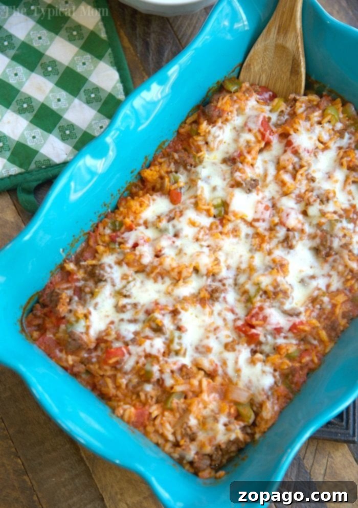 This cheesy stuffed pepper casserole is a family favorite for sure! Like deconstructed stuffed bell peppers it's an easy casserole topped with lots of cheese you can throw together and even my kids love it! Packed with the classic flavors you remember it is easier to make and great the next day too. #stuffed #pepper #peppers #casserole #easy #dinner #groundbeef #unstuffed #rice #green Cheesy Stuffed Pepper Casserole with Rice