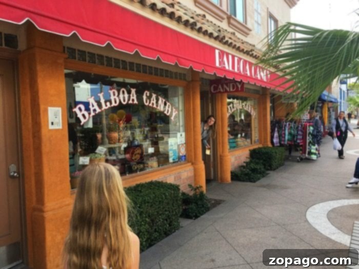 Explore Balboa Fun Zone 2 The vibrant atmosphere of Balboa Newport Beach with shops and people enjoying the boardwalk