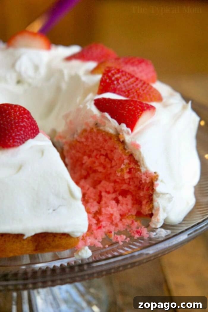This 2-ingredient strawberry cake with soda pop is an amazing and easy-to-make dessert. It's egg-free, super moist, and lower in calories, making it a delicious choice for any occasion. Some call it soda pop cake or a throw-together dump dessert, but everyone raves about it! #strawberrycake #bundtcake #sodacake #skinny #eggfree #cake #dessert 2-ingredient-strawberry-cake