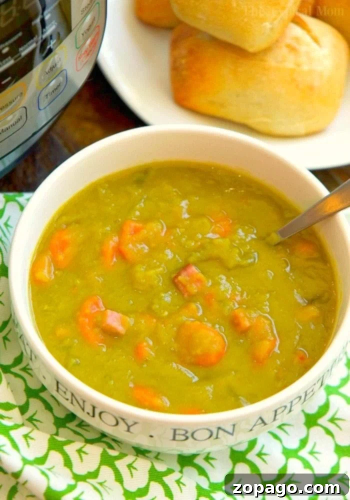 Delicious Instant Pot Split Pea Soup with Ham: A quick, healthy, and easy recipe for your pressure cooker, ready in less than 20 minutes! Steaming bowl of Instant Pot Split Pea Soup with Ham, garnished with fresh herbs and served with crusty bread.