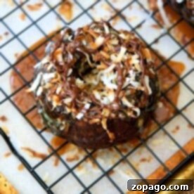 Mini Bundt Bake Times 4 Chocolate mini bundt cake topped with toasted coconut, caramel, and chocolate drizzle.