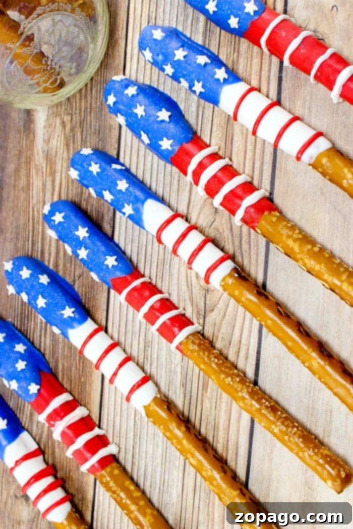 Chocolate Fourth of July patriotic pretzels that look like flags! Easy and fun red white and blue dessert. #fourthofjuly #pretzels #dessert #partyfood Fourth of July Patriotic Pretzels - close up of flag design