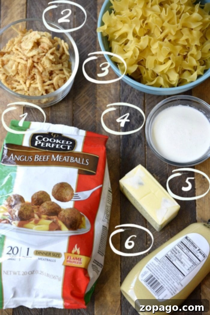 This easy Swedish meatball casserole recipe is a quick and creamy comfort food, perfect for family dinners. Made with frozen meatballs and crispy onions. A vibrant blue baking dish filled with creamy Swedish meatball casserole, featuring plump meatballs, egg noodles, and a golden layer of crispy fried onions.