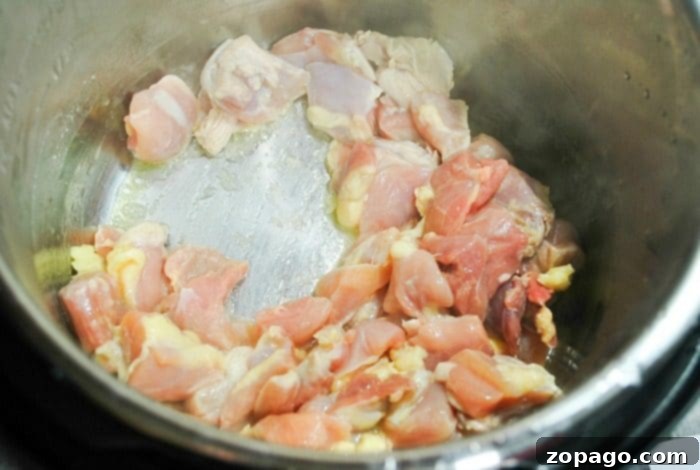 Spicy Honey Instant Pot Chicken Thighs cooking in a pressure cooker Pressure cooker chicken in an Instant Pot.