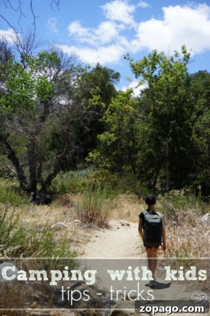 Camping with Kids: Building Memories in the Wilderness on a Budget Family camping in a tent, symbolizing affordable outdoor adventures and family fun.