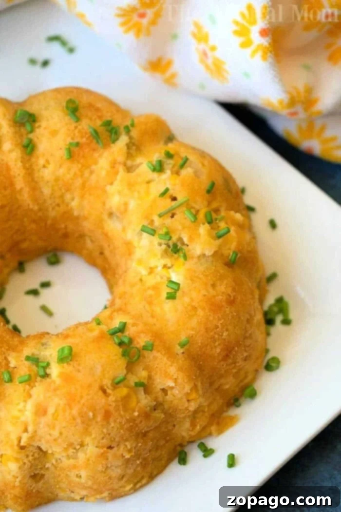 Creamy Instant Pot Corn Casserole 3 A beautifully ring-shaped Instant Pot corn casserole, perfectly steamed and golden, rests on a cooling rack, signifying a delightful and easy-to-make holiday side dish.