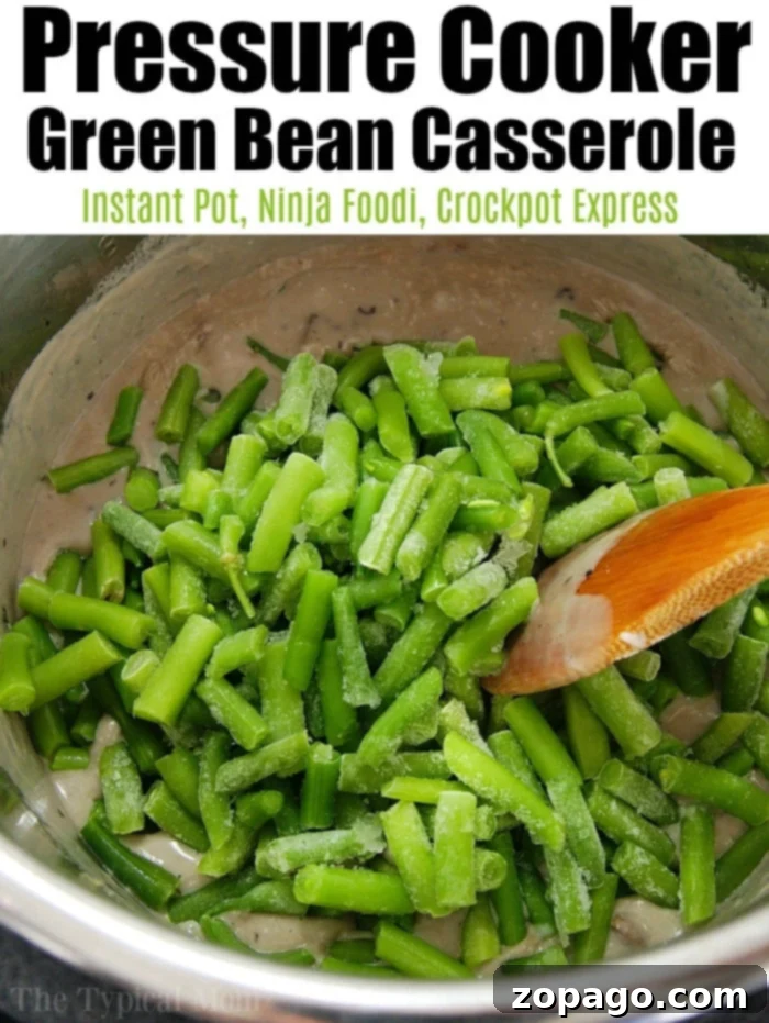 Pressure cooker green bean casserole is a homemade delight for your Ninja Foodi, Crockpot Express, or Instant Pot. #homemade #greenbeancasserole #ninjafoodi #crockpotexpress #instantpot #pressurecooker Pressure cooker green bean casserole with crispy onions and bacon, served in a festive white dish.