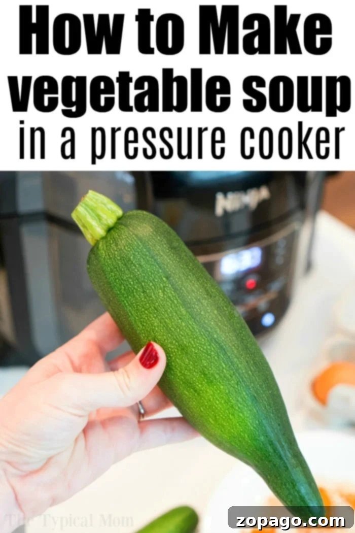 Wholesome Instant Pot Minestrone 3 A rustic bowl of Instant Pot vegetable soup, rich with diced tomatoes, zucchini, and carrots, garnished with fresh herbs, showcasing its healthy appeal.