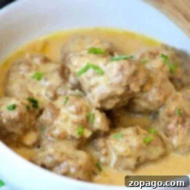 A bowl of easy homemade Swedish meatballs in creamy sauce, garnished with chopped chives, a delightful dish crafted in your Instant Pot.
