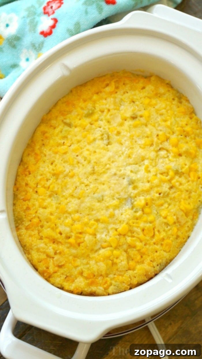 Crockpot Corn Casserole: Cheesy and perfect for holidays. Easy Crockpot Corn Casserole recipe, a cheesy and moist vegetarian side dish perfect for Thanksgiving or Christmas.