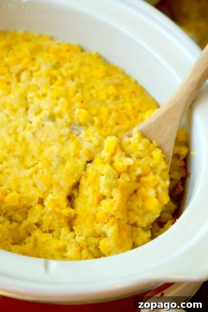 Delicious Easy Crockpot Corn Casserole recipe. A close-up of the easy crockpot corn casserole, showcasing its golden crust and fluffy texture.