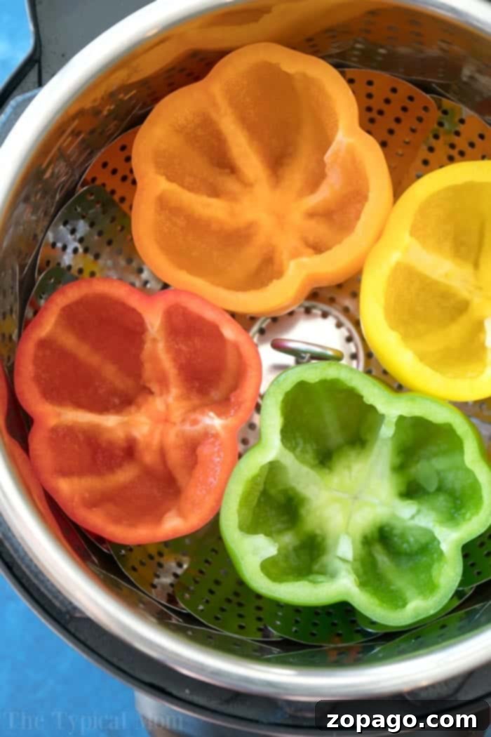 Instant Pot stuffed peppers will be your favorite pressure cooker meal! Green peppers stuffed with cheesy ground beef and rice they're packed with flavor and will bring you back to your childhood! #instantpot #pressurecooker #stuffedpeppers #crockpotexpress #instantpotrecipes #thetypicalmom Instant Pot Stuffed Peppers, close up of filling