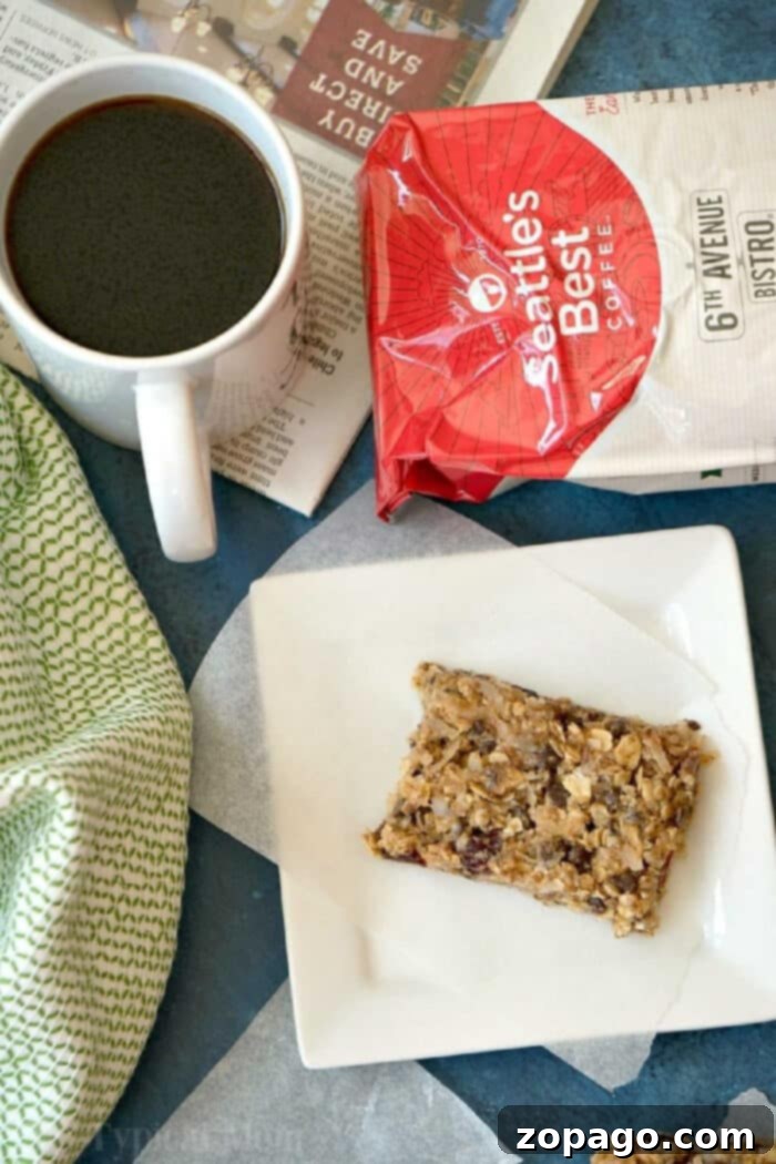 Start Your Day Right: Homemade Granola Bars & Coffee! Four freshly cut homemade granola bars with a cup of coffee, showcasing a perfect breakfast combination