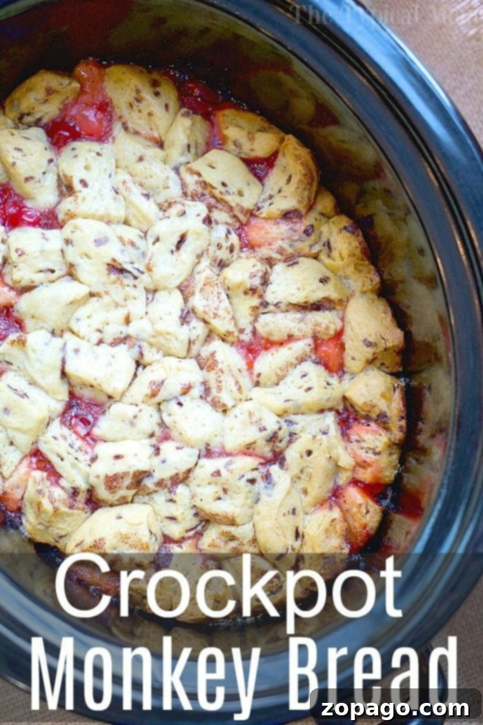 This easy crockpot cinnamon roll monkey bread casserole is perfect for dessert or breakfast! Use any pie filling you like and with 3 ingredients it's done! crockpot-cinnamon-roll-monkey-bread
