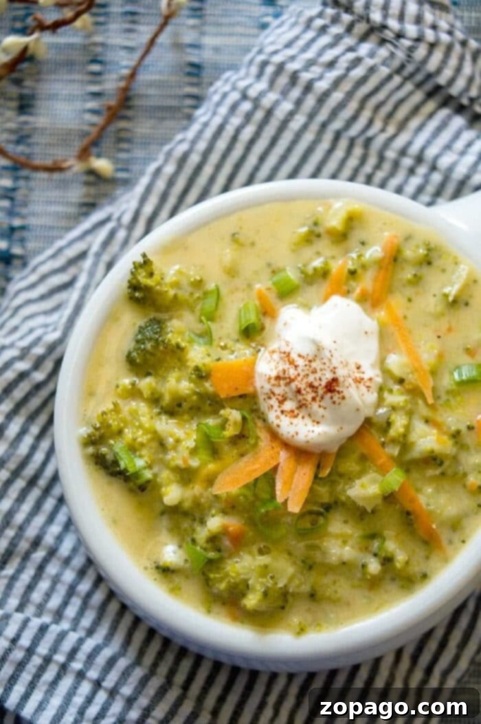 Quick broccoli cheese soup at home! It's the perfect dinner idea when it's cold outside or year round really. Creamy and cheesy with fresh vegetables inside it is sure to become your family's favorite too. #homemade #broccoli #soup #cheese #broccolicheeseso up quick-broccoli-cheese-soup