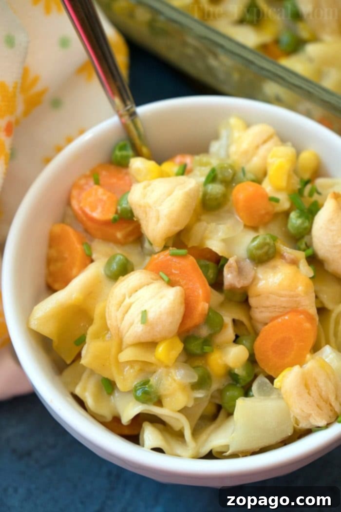 Easy Chicken Pot Pie Casserole with golden biscuit topping and creamy filling