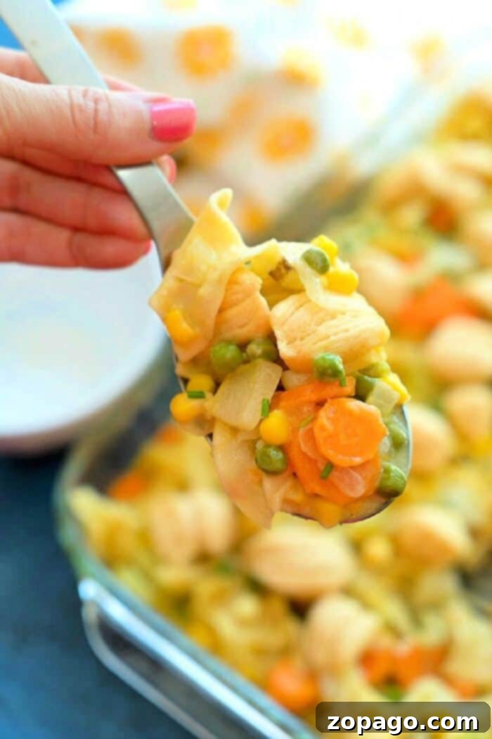 Hearty chicken pot pie casserole with noodles, chicken, and mixed vegetables