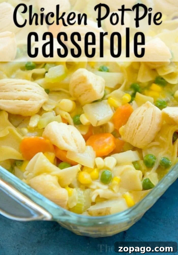Close-up of baked chicken pot pie casserole with golden biscuit pieces